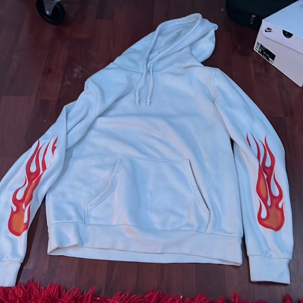white hoodie with flame decals on sleeves and “Keep the mood” decal on the back